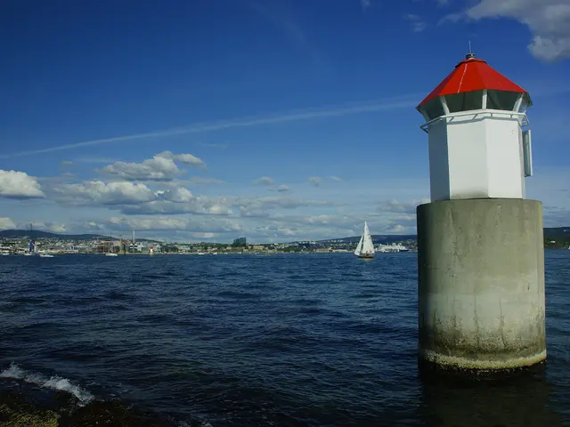 In this image there are boats on the sea and there is a lighthouse, in the background there are...