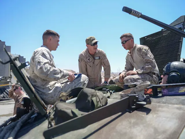 This is the picture of a place where we have some people, among them one is wearing hat and two...